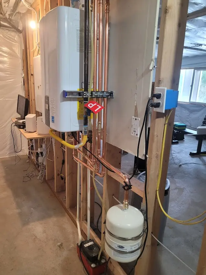 Licensed plumber repairing a kitchen sink in Fairhope